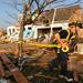 A Dexter firefighter tapes off the most damaged houses in Huron Farms neighborhood after a tornado hit Dexter, Mich. on March 16, 2012.  Angela J. Cesere | AnnArbor.com